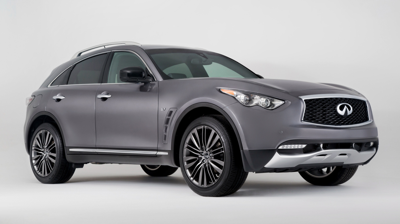 Серебристый автомобиль Infiniti QX70 на сером фоне
