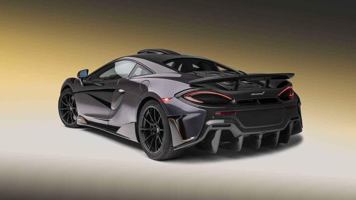Черный спортивный автомобиль  McLaren 600LT, 2019 года вид сзади