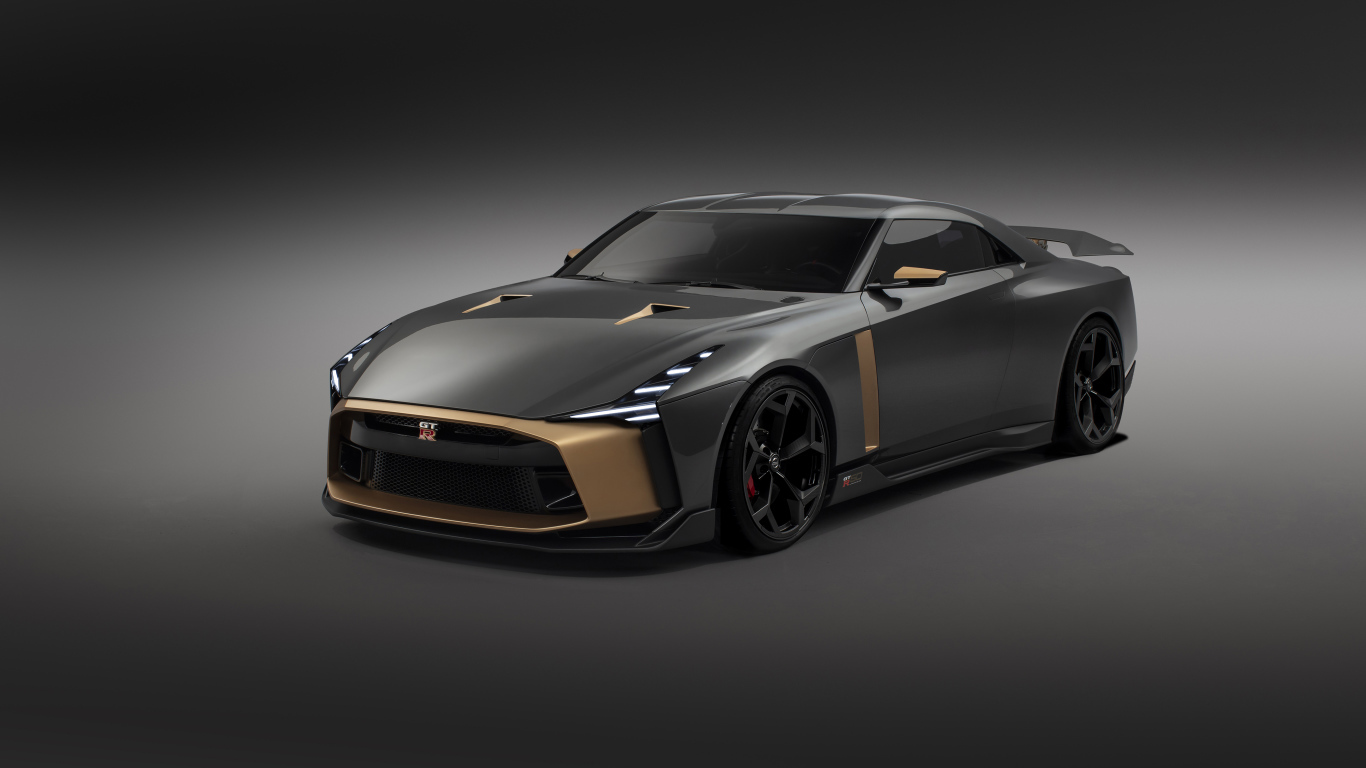 Автомобиль Nissan GT-R50 2018 года на сером фоне