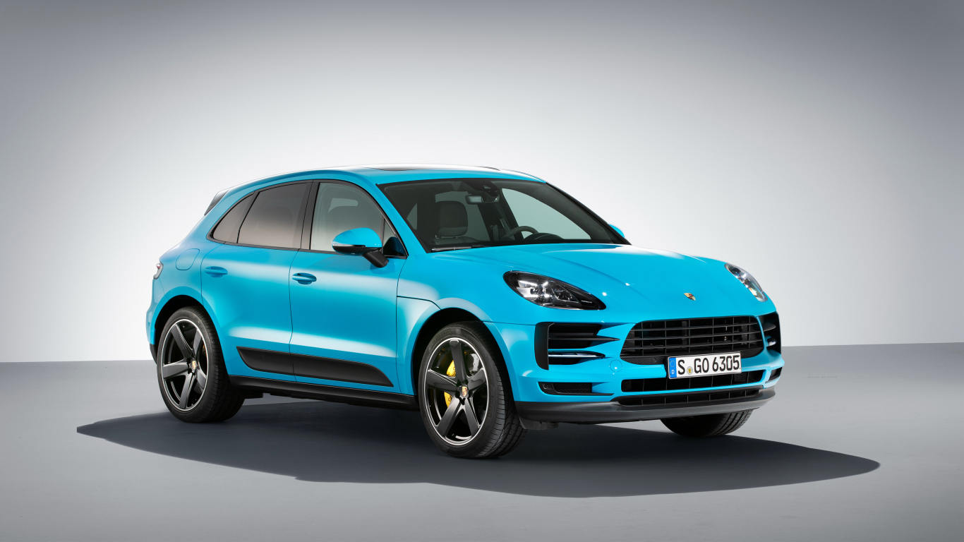 Голубой автомобиль  Porsche Macan S, 2018 на сером фоне