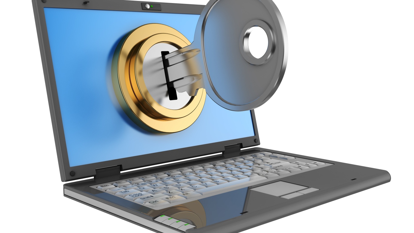 Ключ в замочной скважине на мониторе ноутбука