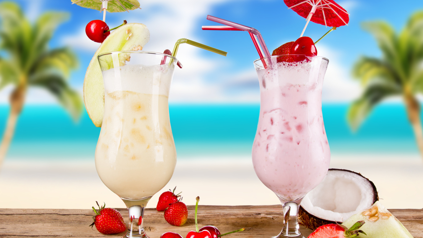 Два тропических коктейля на столе 