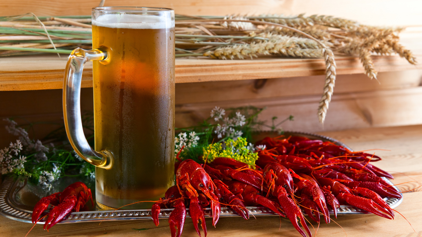 Cooked crawfish on the table with a glass of beer