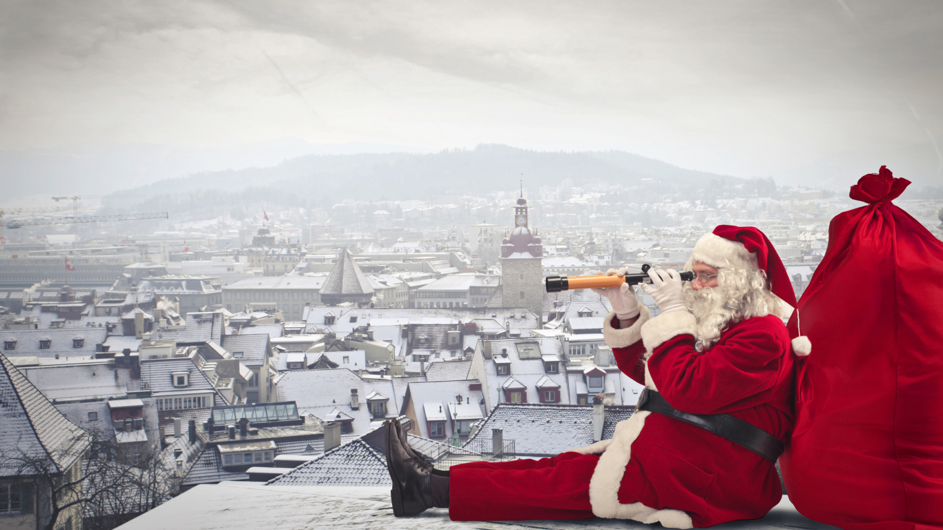 Санта Клаус сидит на крыше дома с большим красным мешком