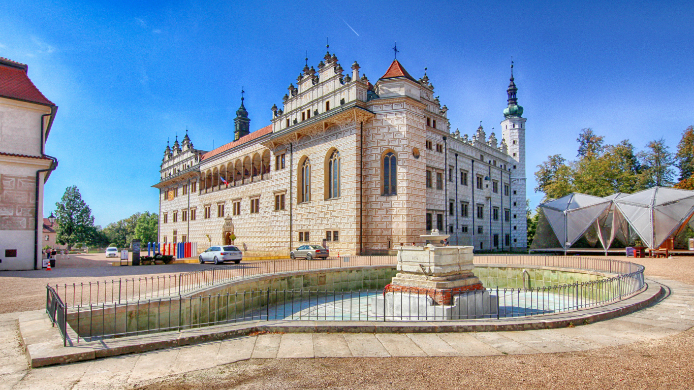 Litomyšl Castle with a fountain under the blue sky, Czech Republic