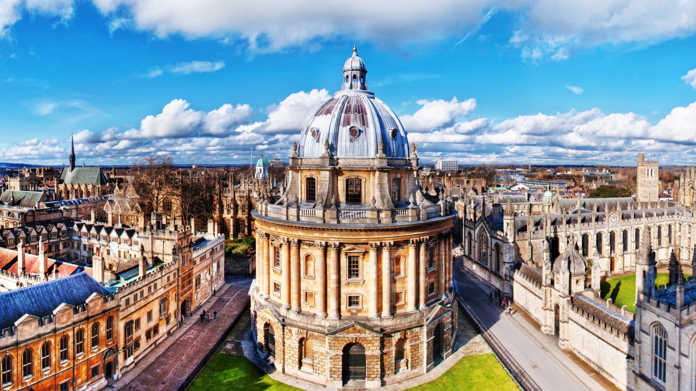 Oxford University building under a blue sky, England