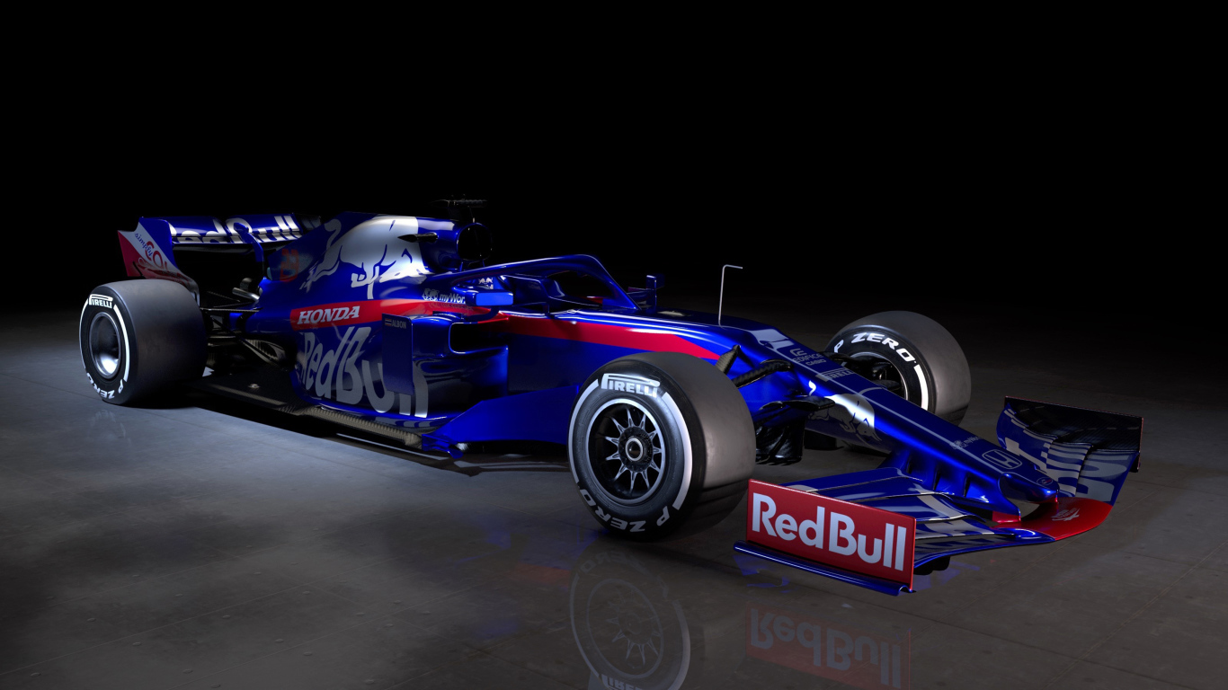 Синий гоночный автомобиль Toro Rosso STR14 2019 года на черном фоне