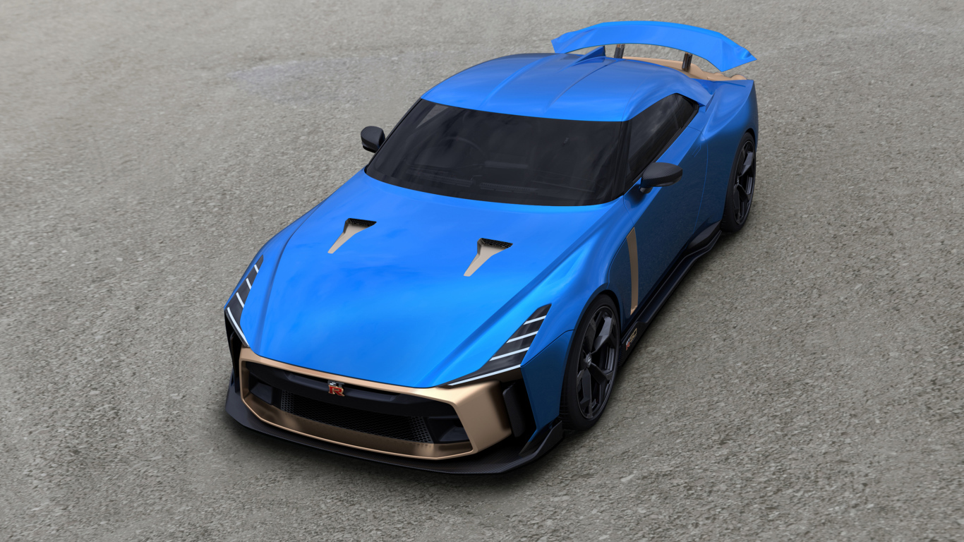 Синий автомобиль Nissan GT-R50 2019 года на сером асфальте