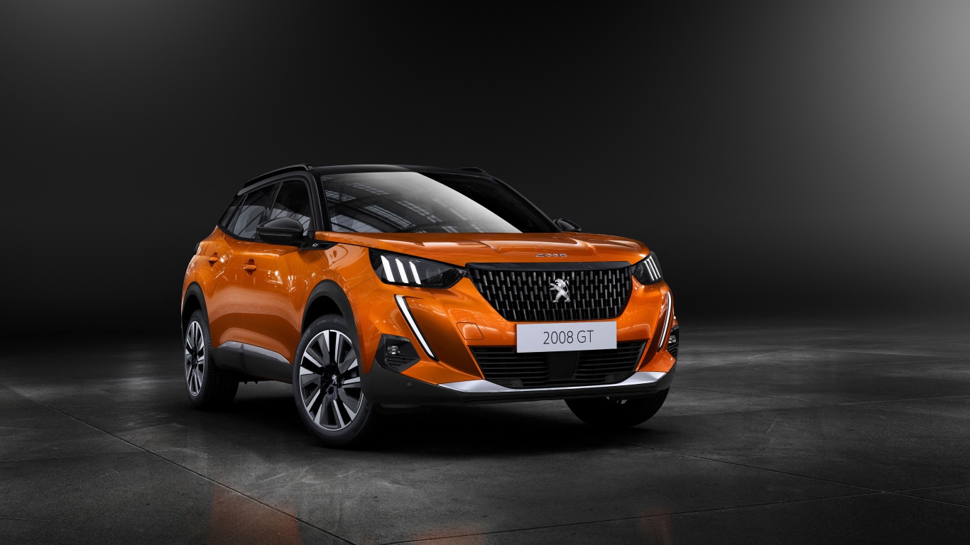 Оранжевый внедорожник Peugeot 2008 GT, 2019  года на сером фоне