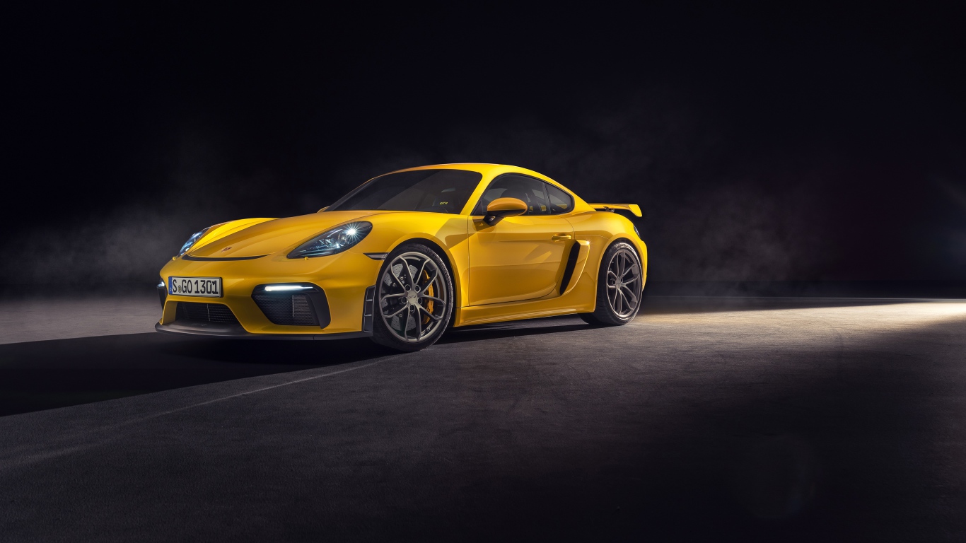 Yellow sports car Porsche 718 Cayman GT4, 2019 year on a gray background
