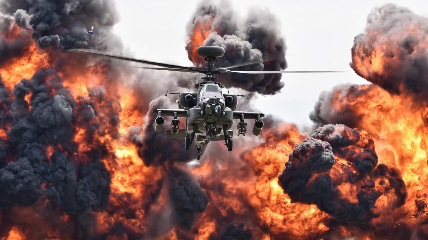 Ударный вертолет армии США Boeing AH-64 Apache в клубе огня