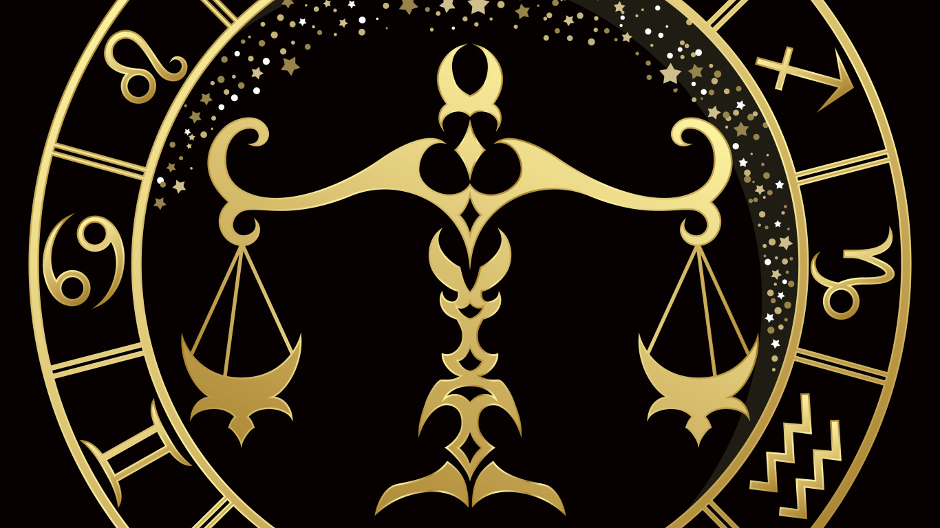 Золотой знак зодиака весы на черном фоне