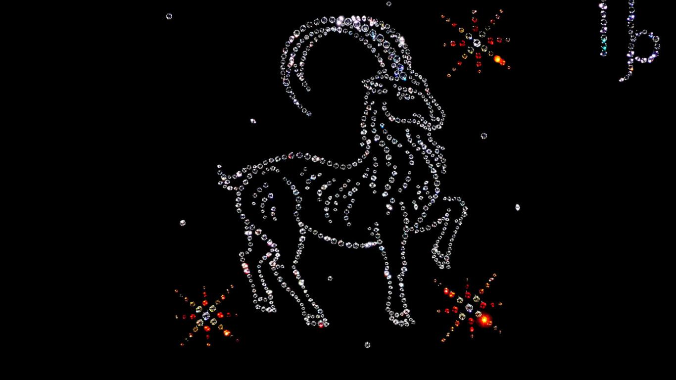 Блестящий знак зодиака козерог  на черном фоне