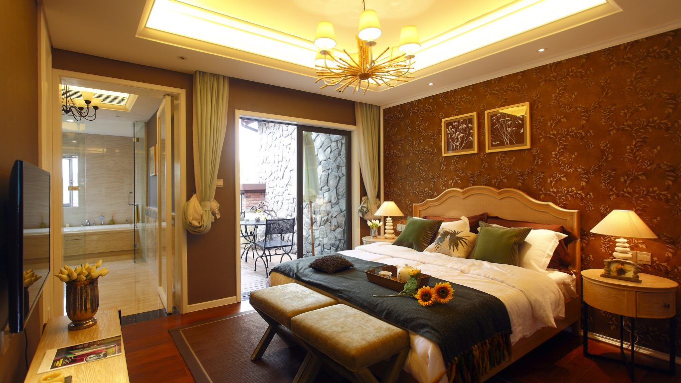 Красивая спальня с большой кроватью и телевизором 