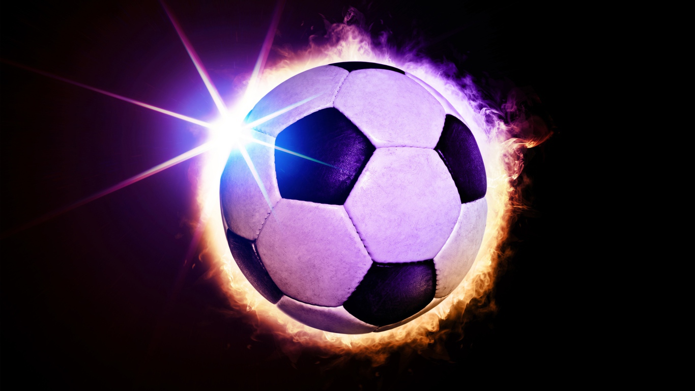 Soccer ball in ring of fire on black background