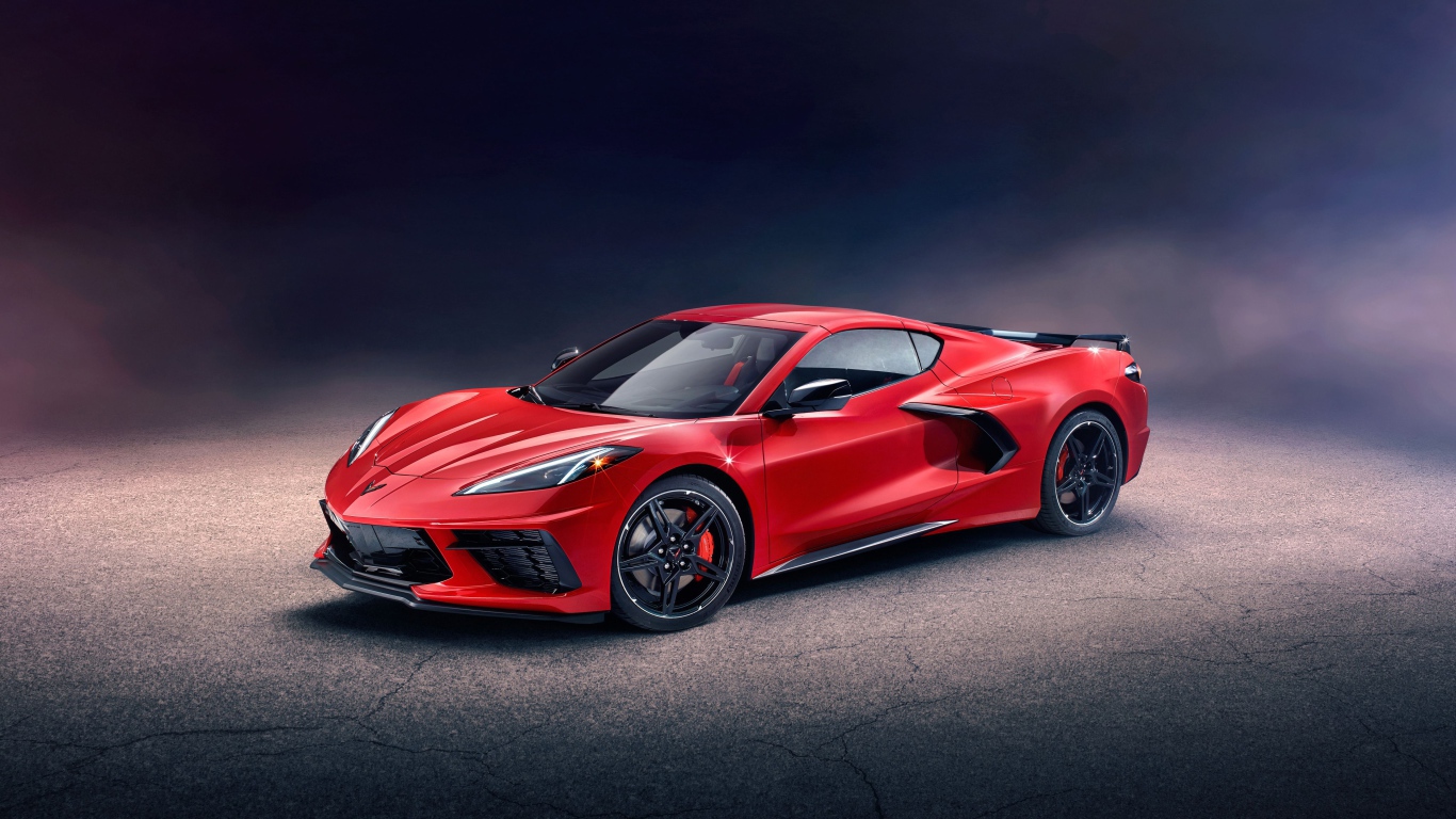 Красный автомобиль Chevrolet Corvette Stingray Z51 Preserial  на сером фоне