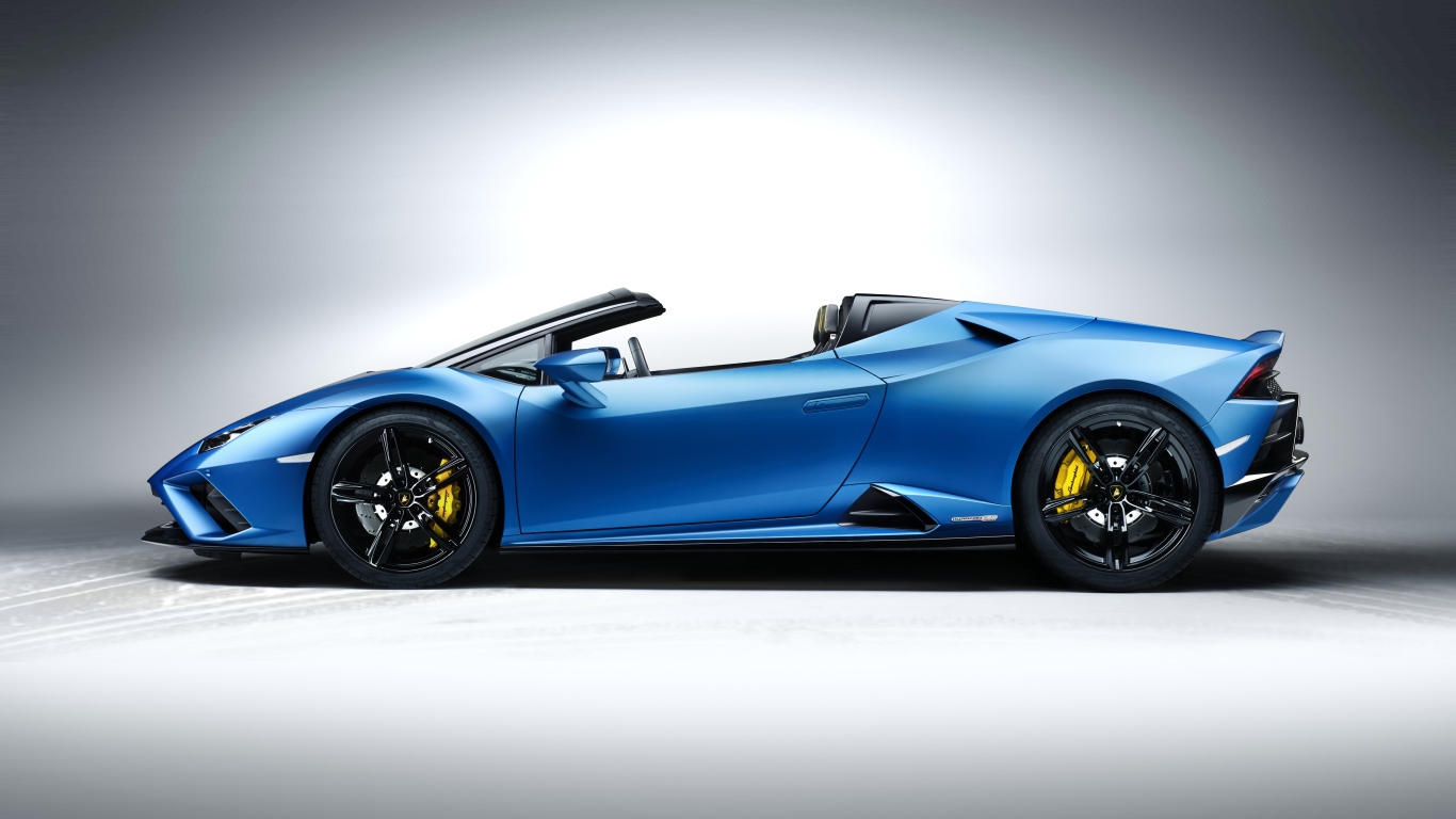Дорогой быстрый автомобиль Lamborghini Huracan EVO RWD Spyder 2020 года на сером фоне 
