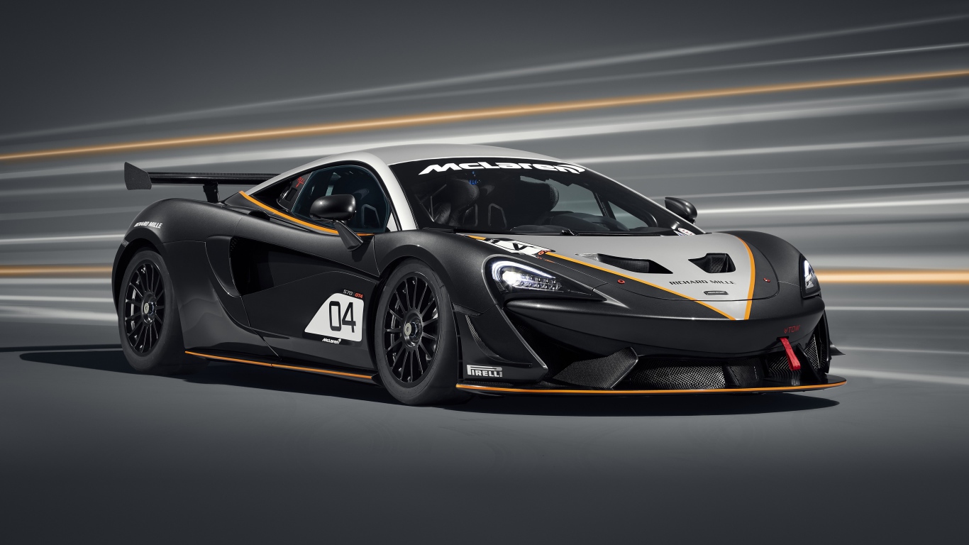 Спортивный автомобиль McLaren 570S GT4 2020 года на сером фоне