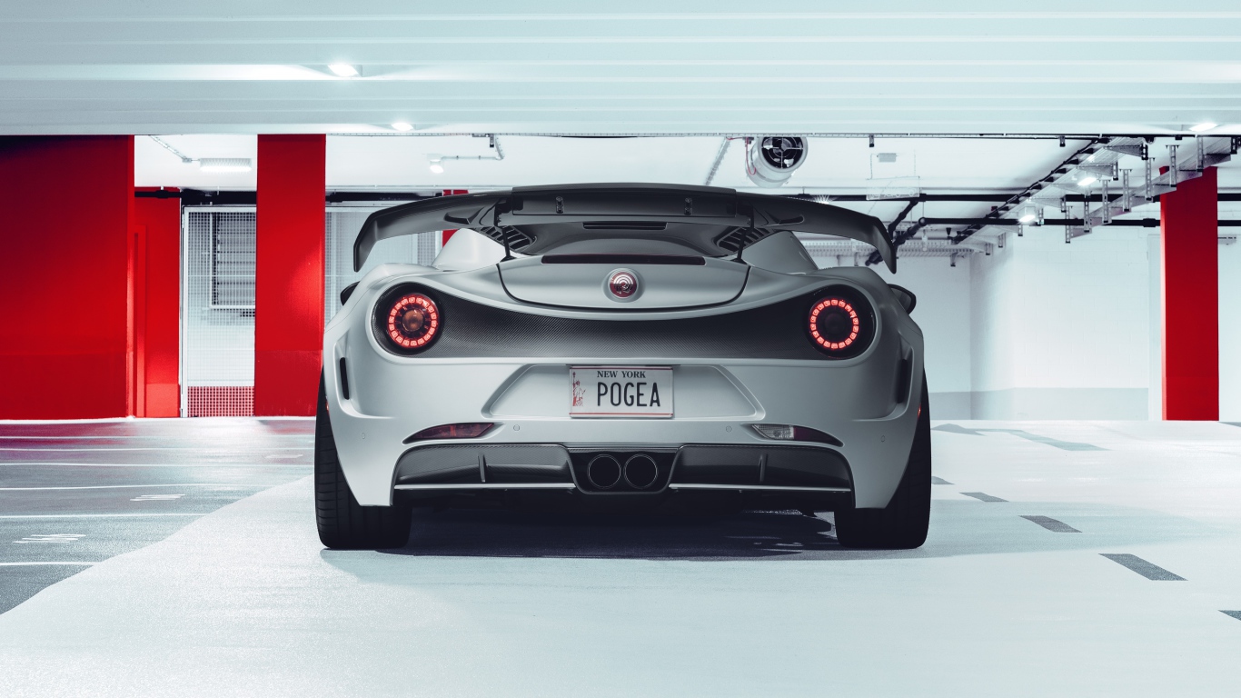 Серый автомобиль Pogea Racing Nemesis 2020 года вид сзади