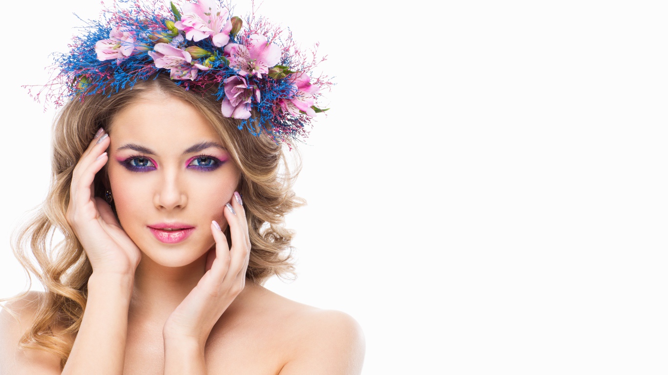Very beautiful girl with a wreath on her head on a white background
