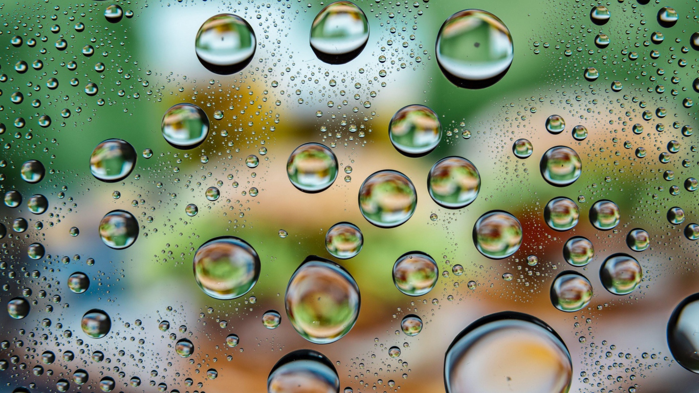 Big bubbles of water on glass