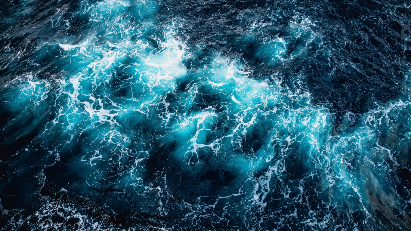 Top view of white waves in the ocean