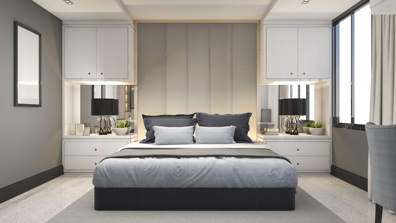 Большая двуспальная кровать в серой спальне