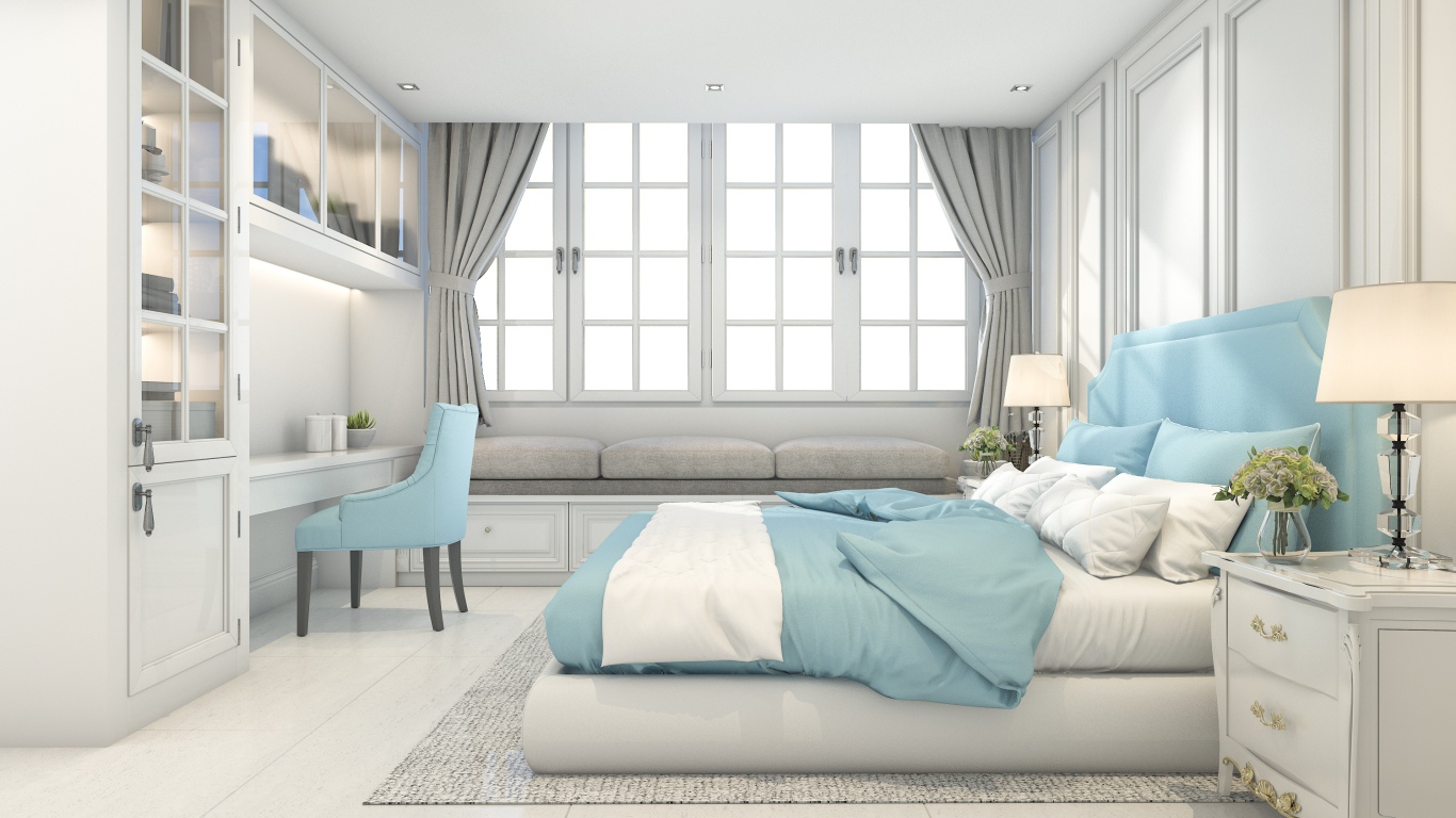 Большая спальня в серых тонах с кроватью и окнами