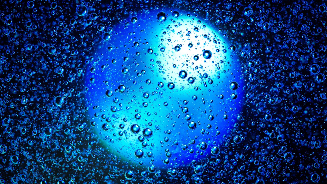 Round blue ball in water with bubbles