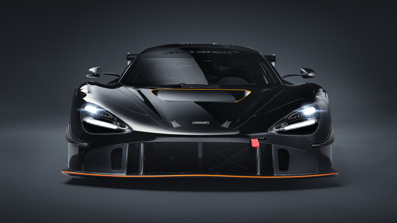 Автомобиль McLaren 720S GT3X 2021 года вид спереди на сером фоне