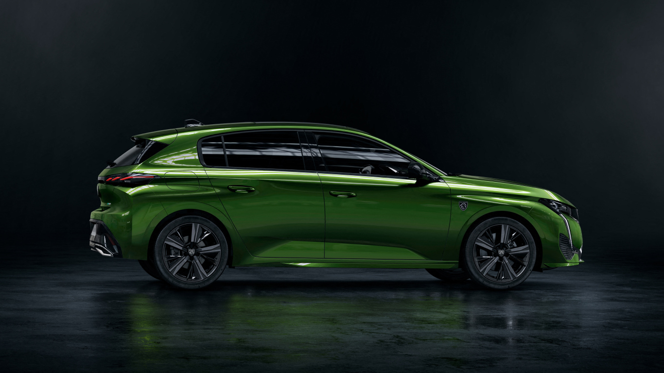 Автомобиль Peugeot 308 вид сбоку на черном фоне