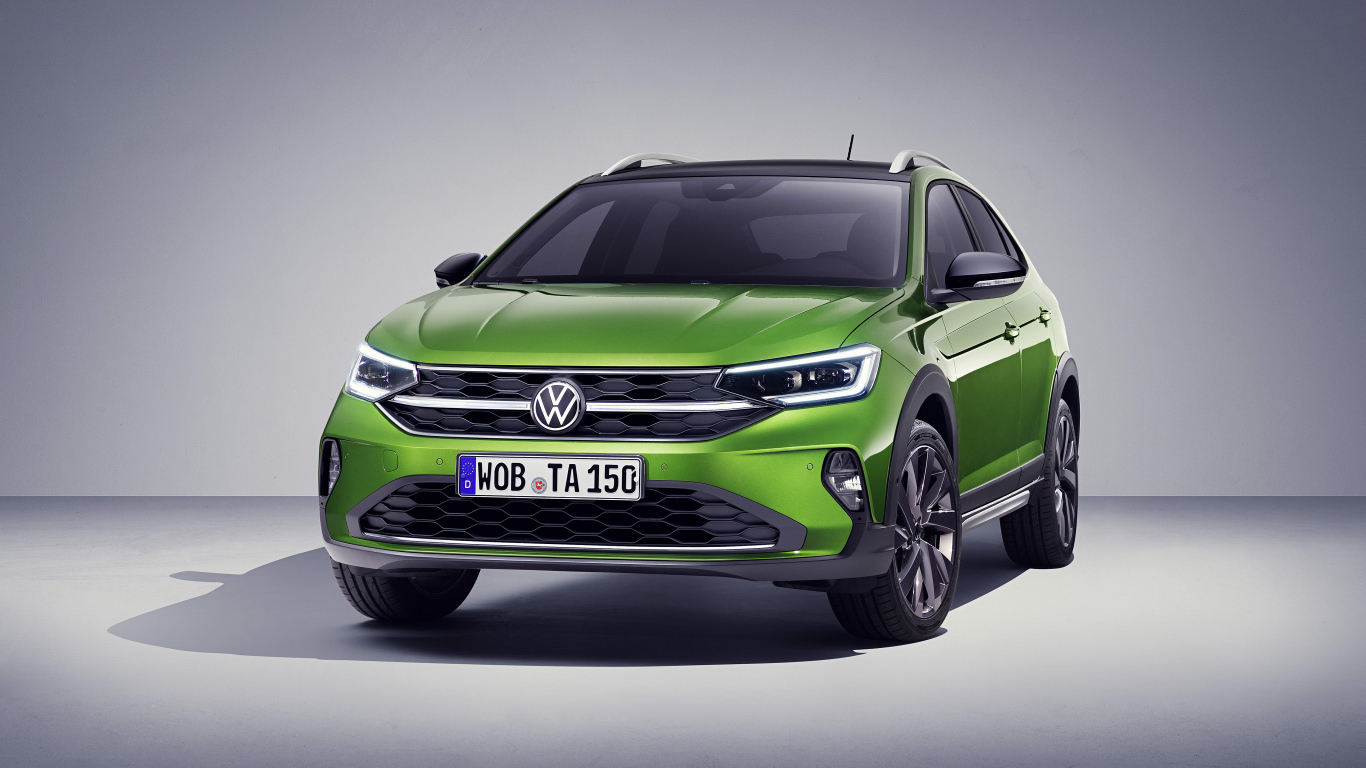 Зеленый стильный Volkswagen Taigo 2021 года на сером фоне