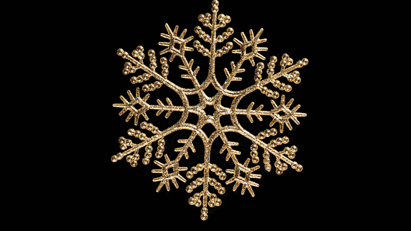Красивая золотистая снежинка на черном фоне