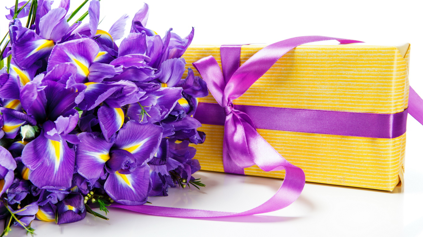 Цветы ириса и подарок на белом фоне на 8 марта