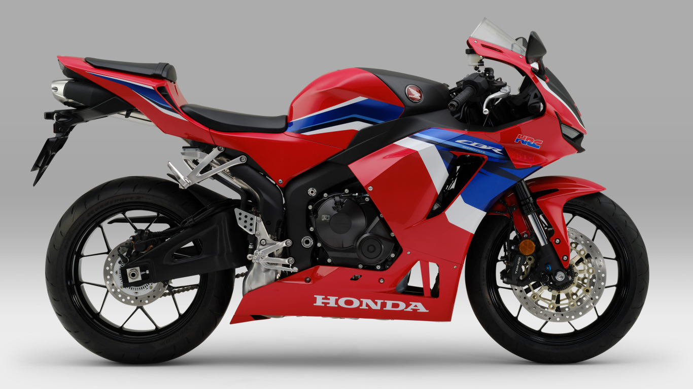 Красный мотоцикл Honda cbr600rr 2021 на сером фоне