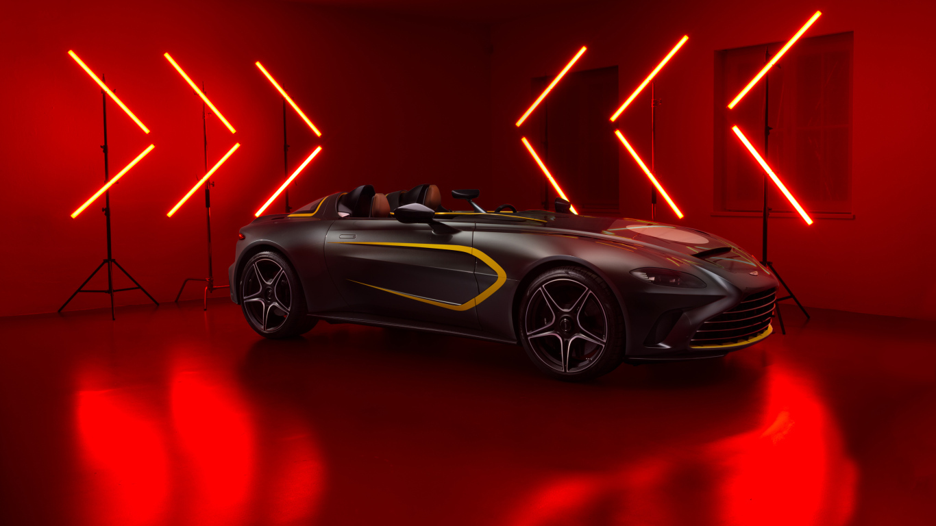 Спортивный Aston Martin V12 Speedster на красном фоне