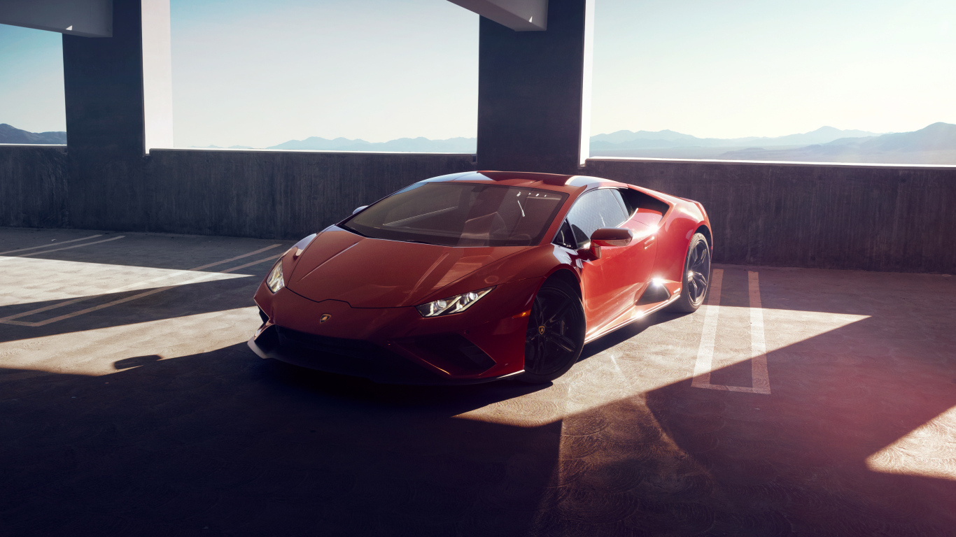 Быстрый красный автомобиль Lamborghini Huracan EVO RWD