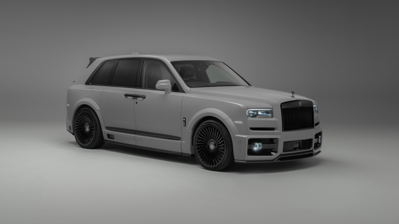 Автомобиль Rolls-Royce Cullinan на сером фоне