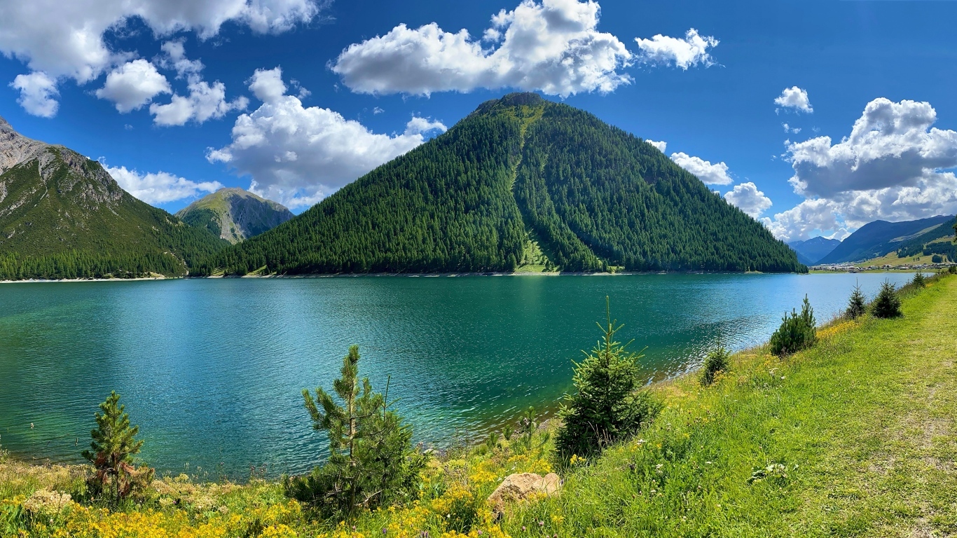 Reservoir Lago di Livigno near the mountains, Italy