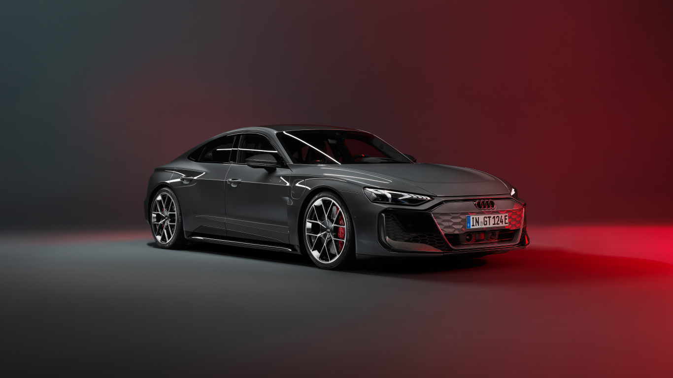Автомобиль Audi RS e-tron GT 2024 года на красном фоне