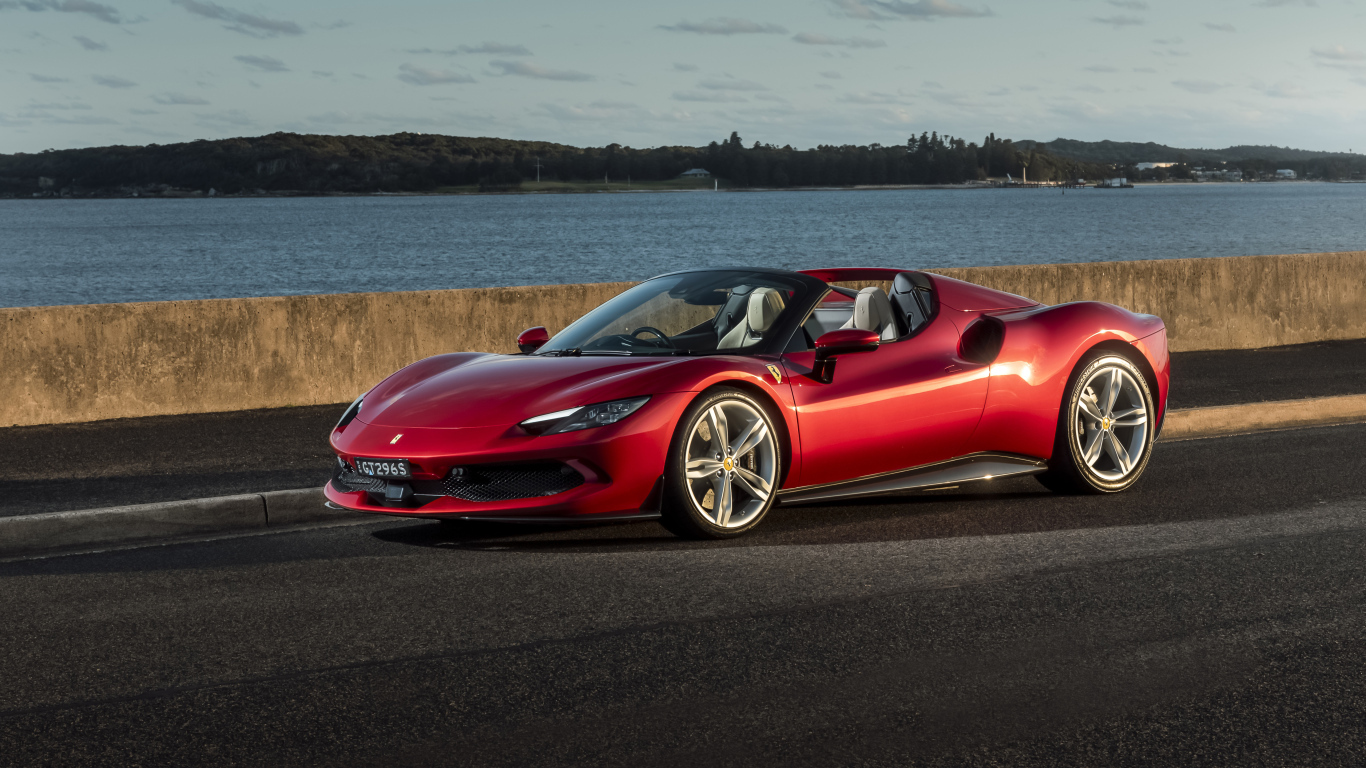 Красный автомобиль Ferrari 296 GTS у реки