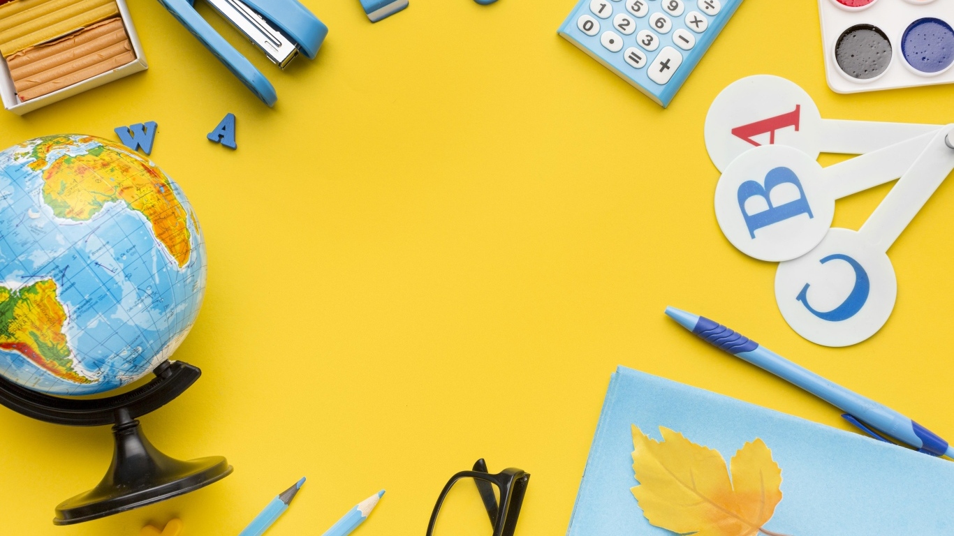 Красивые канцелярские предметы и глобус на желтом фоне