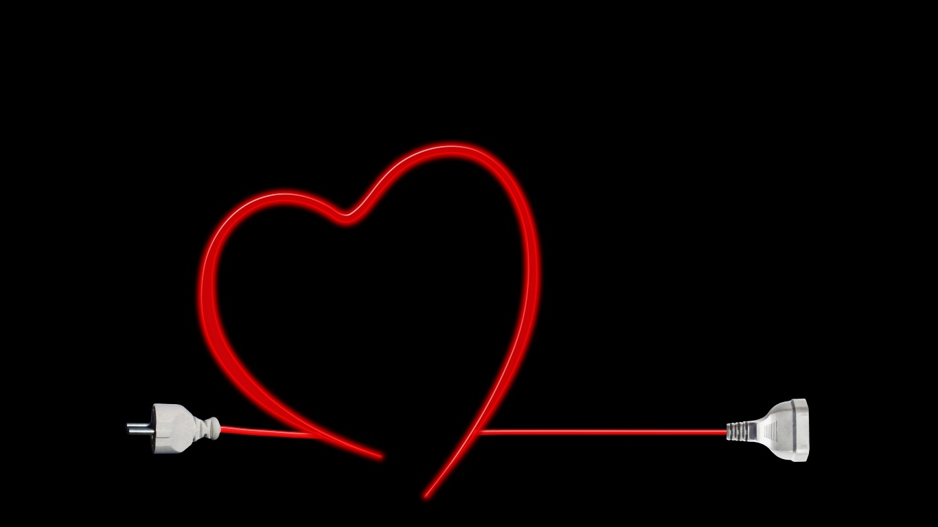 Красное сердце из провода на черном фоне