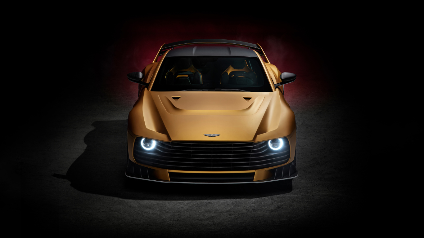 Золотистый автомобиль Aston Martin Valiant 2024 года вид спереди