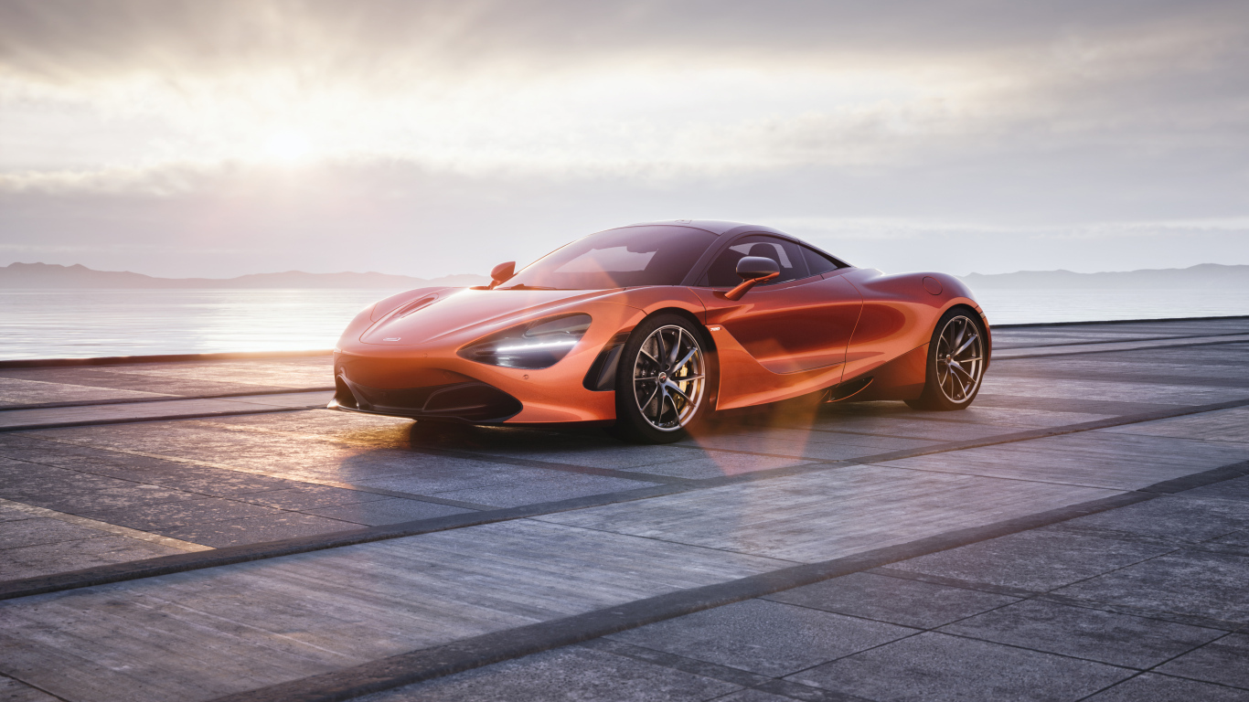 Оранжевый автомобиль McLaren 720S у озера