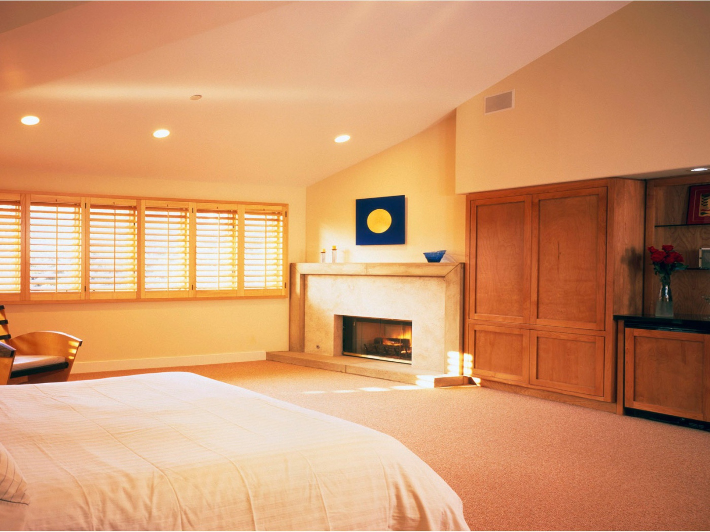 Bedroom with fireplace on a summer residence