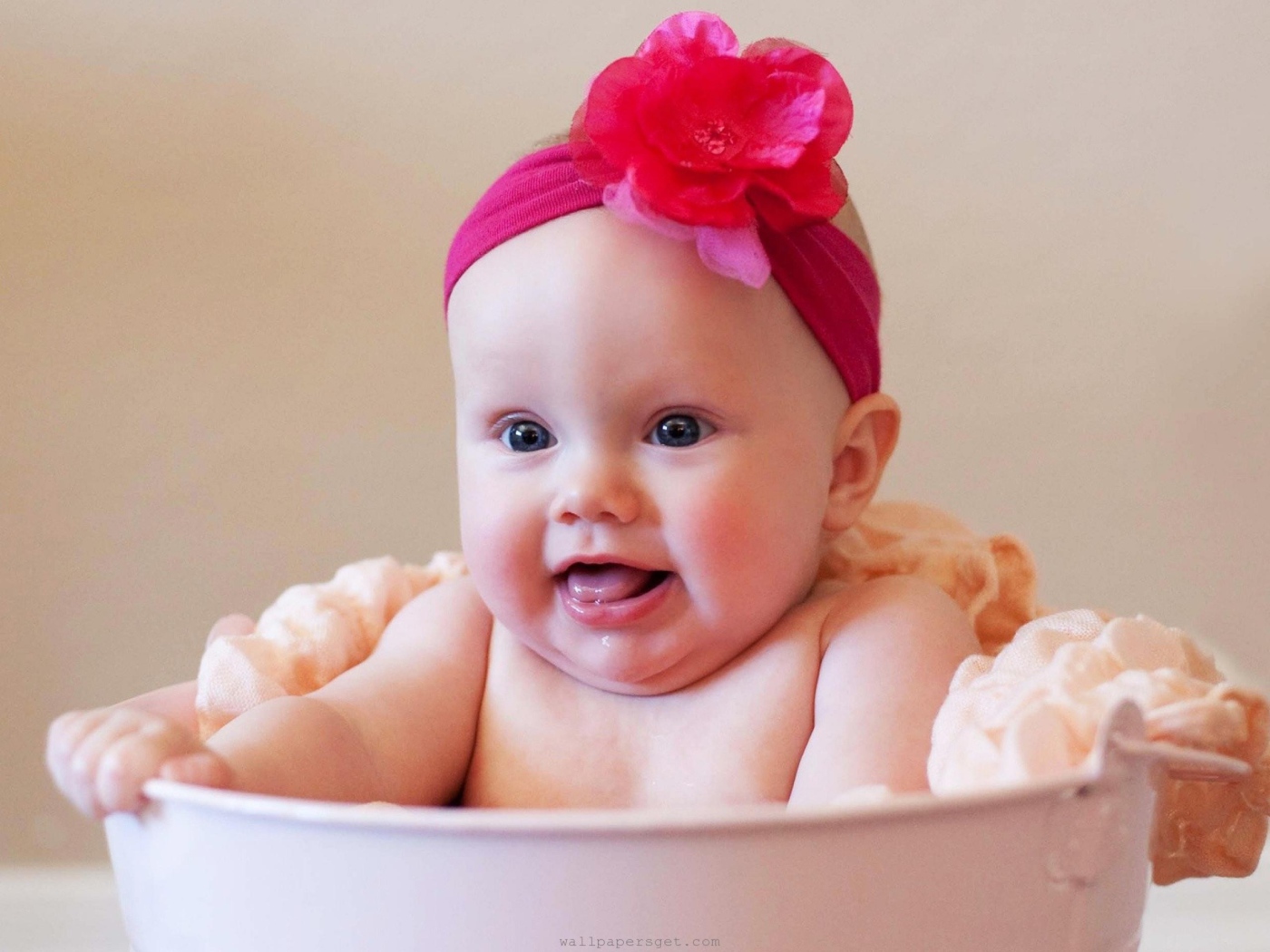 	   Baby bathing and smiles
