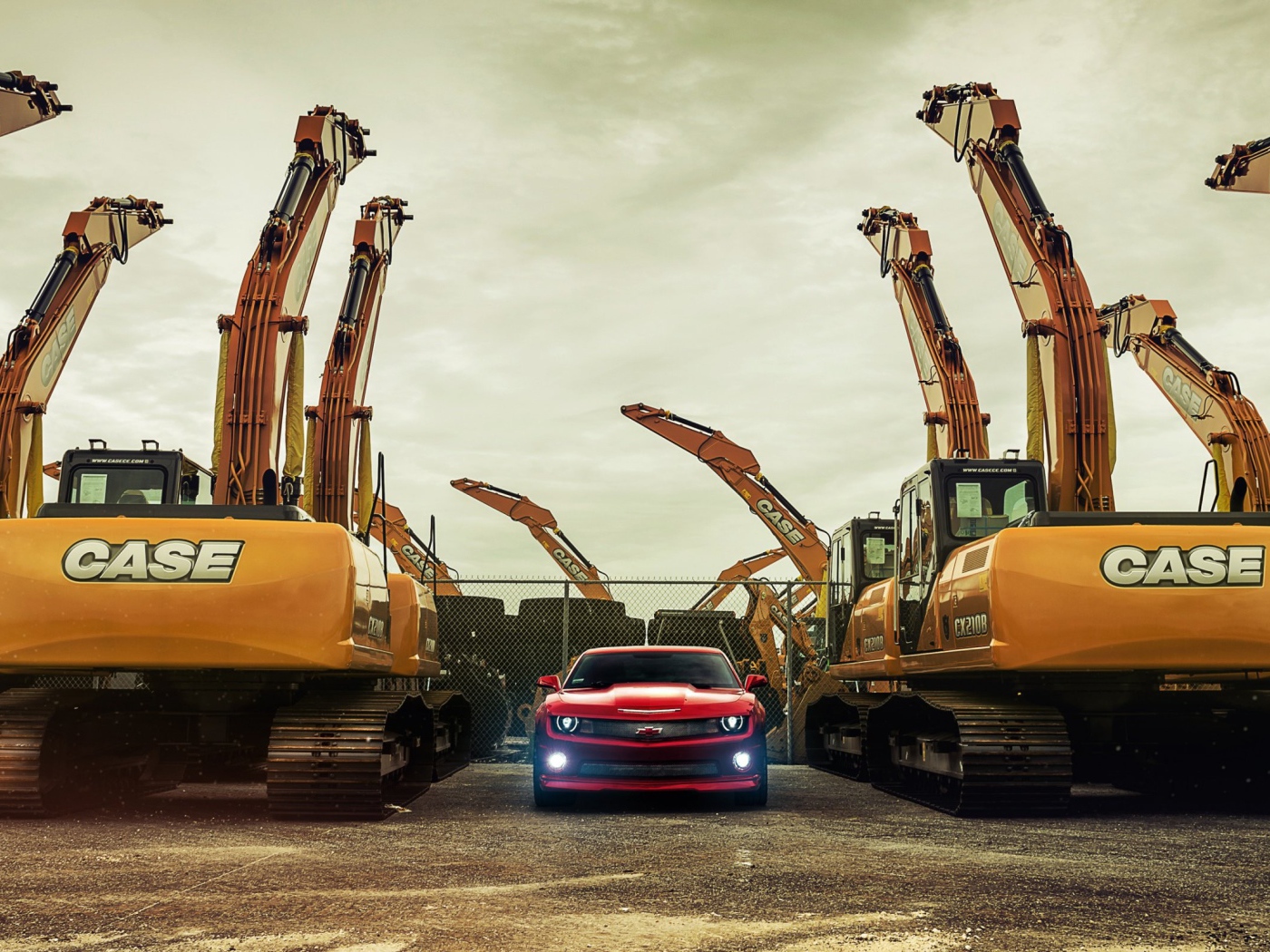 Chevrolet Camaro между экскаваторами