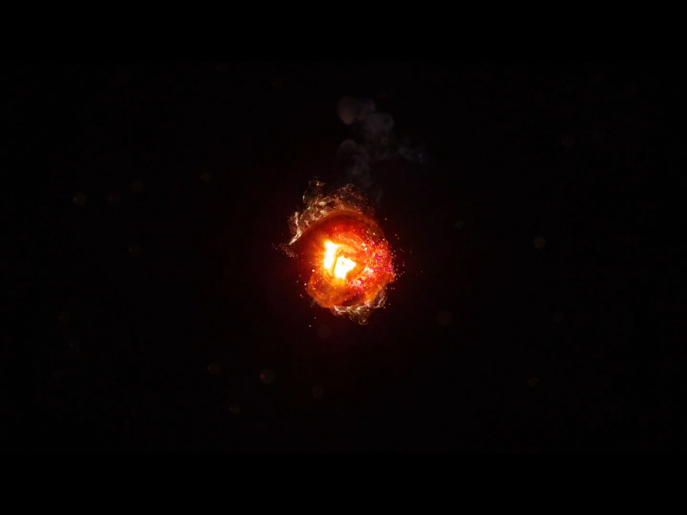 Горящий уголек, черный фон