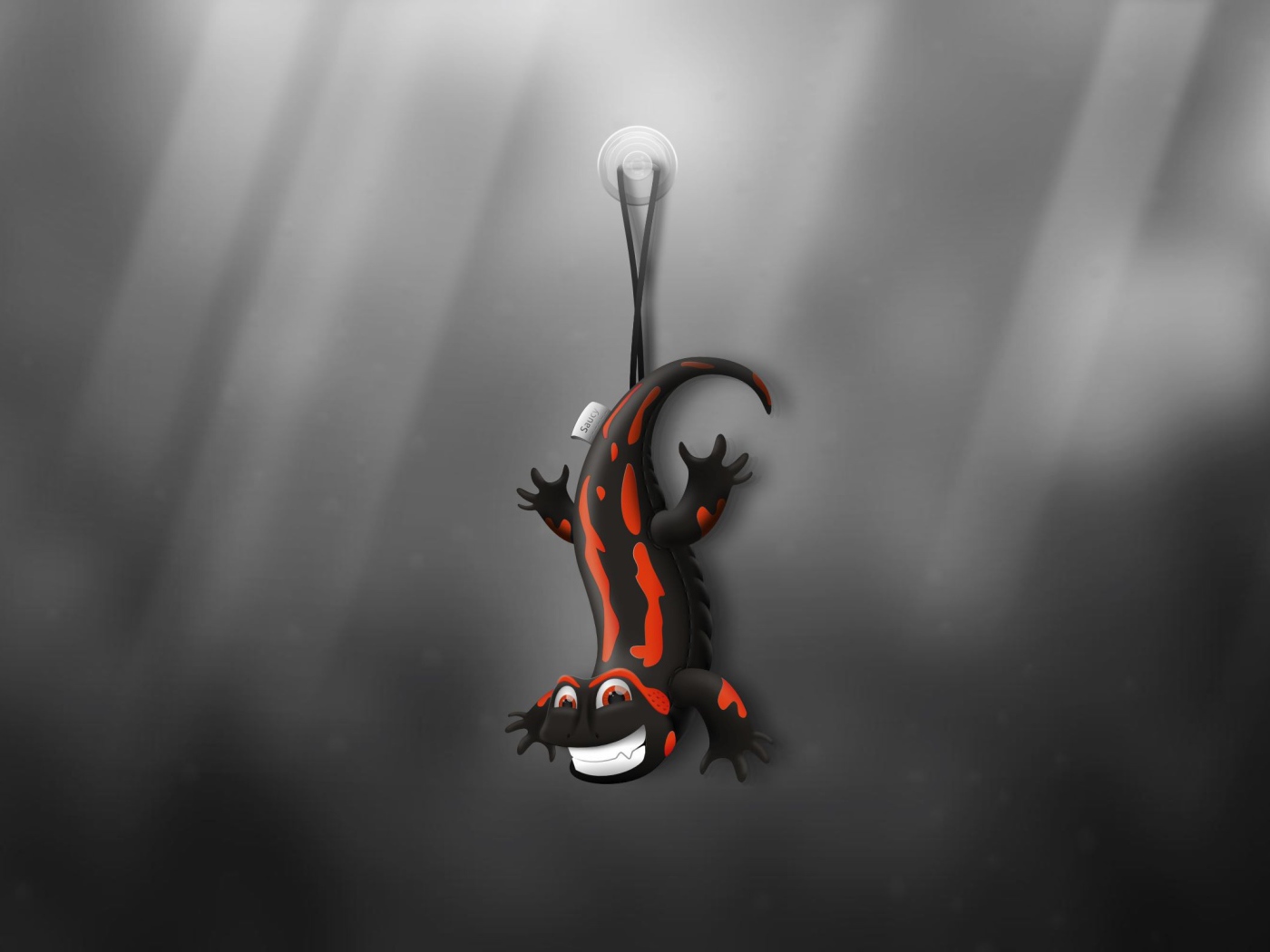 Ящерица игрушка, серый фон